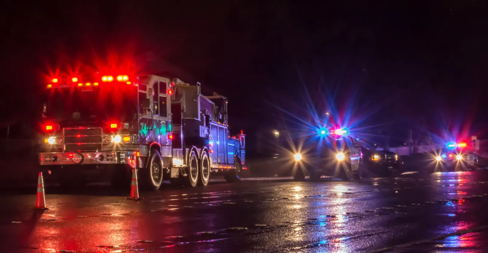 First Responders - firefighters and police officers - on a wet night
