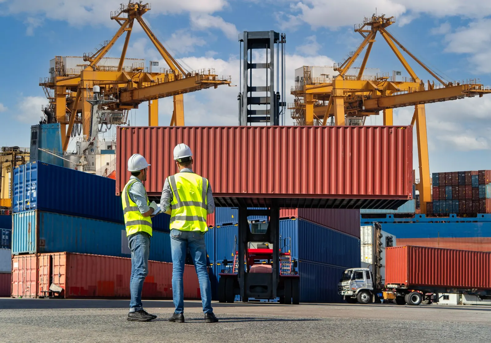 maritime workers with cargo ship