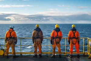 boat workers looking at ocean